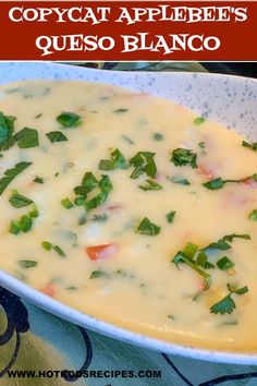 a white bowl filled with soup and garnished with cilantro