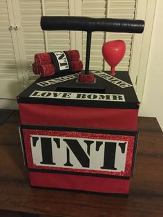 a box that has some boxing gloves on top of it, and two red balls in the middle