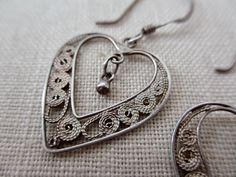 This listing is for a pair of sterling silver earrings with a filigree design. great condition, lightweight Each measures 20mm long, 18mm wide (32mm long from the top of the ear wire) stamped '925' on the wire Cave Creek Az, Tintype Photos, Cave Creek, Silver Dangle Earrings, Filigree Design, Sterling Silver Dangle Earrings, Dark Wear, Silver Earrings Dangle, Rare Antique