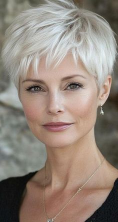 Here are some stylish and flattering hairstyles for women over 70 that embrace elegance and ease: Classic Bob: A timeless bob that falls at the chin or shoulders offers a polished look. It’s versatile and can be styled straight or with soft waves. Short Pixie Cut: A chic pixie cut can be both modern and low-maintenance, highlighting facial features and adding a youthful touch. Soft Layers: Adding soft layers to medium-length hair can create movement and volume without overwhelming the face. White Hair Pixie Cut, Women’s Pixie Cut, Short Hair Cuts For Women Pixie Undercut, Round Face Haircuts Short Double Chin, Feminine Pixie Cuts, Too Cute To Handle, Short White Hair, Flattering Hairstyles, Short Silver Hair