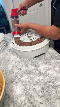 a person using a grinder to cut up food