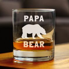 a glass with an elephant and the words papa bear on it