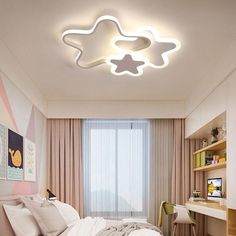 a bed room with a neatly made bed and a star shaped light above the bed