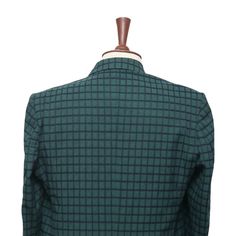 This Chiragh Apparel blazer is an elegant upgrade on dapper tailoring and features rich shades in a sumptuous fabric for elegant opulence. Fashioned from premium quality wool, this check plaid blazer features full lining in Japanese silk, a notch lapel, two-button closure and single-vented back. A left chest pocket and three flap pockets appoint the front while the inside has two (2) pockets on the left and one (1) pocket on the right. A flash of contrast piping is added to the jacket lining ins Formal Long Sleeve Fitted Tweed Jacket, Fitted Long Sleeve Tweed Jacket For Formal Occasions, Fitted Tweed Jacket With Long Sleeves For Semi-formal Occasions, Fitted Long Sleeve Tweed Jacket For Semi-formal Occasions, Tailored Double Breasted Suit With Single Button, Tailored Single Button Double Breasted Suit, Fitted Single Breasted Nehru Jacket With Long Sleeve, Fitted Single-breasted Nehru Jacket With Long Sleeves, Tailored Long Sleeve Semi-formal Blazer