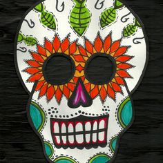 a colorful sugar skull with flowers on it