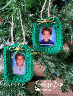 two ornaments hanging from a christmas tree decorated with green yarn and twine photo frames