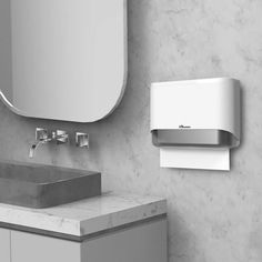 a bathroom with a sink, mirror and soap dispenser on the wall