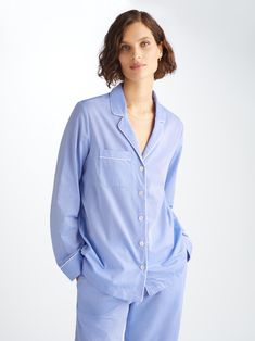 Designed for a flattering but comfortable shape, our Amalfi pyjamas will keep you looking great and feeling comfortable all year round. Made from our blue cotton batiste, the Amalfi jacket features a fully piped finish in a white trim, a single patch pocket and buttons. The quality of craftsmanship continues with the trousers and their elasticated waist with self fabric drawstrings for added comfort. A firm favourite of our customers for its breathability, lightweight properties and luxuriously Batiste Fabric, Derek Rose, Cotton Pajamas Women, Pyjamas Womens, Women's Pajamas, Cotton Pajama Sets, Women Nightwear, Print Pajamas, Cotton Pyjamas