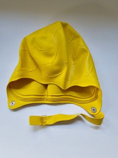 Super retro chic Janzen swim cap. Yellow with diving ladies pattern.  The cap is in excellent vintage condition with no signs of wear. The snaps function as they should and the rubber is in great shape. It isn't hard or brittle. The package does have some holes but it does not affect the quality or condition of the cap. The package says size Adult. I did not try it on so I'm unsure of the size. Please feel free to message me with any questions. This cap would make an awesome addition to your vintage swimwear and the color is so pretty!  Thanks for looking. Retro Swim, Swimming Costumes, Bathing Cap, Swimming Cap, Bathing Costumes, Swim Cap, Cap Ideas, Vintage Swimwear, Rubber Boot