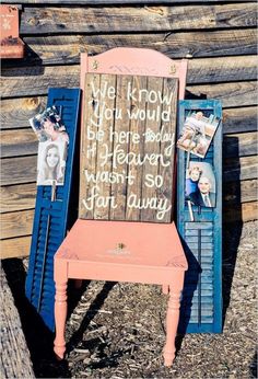 an old chair with writing on it and pictures attached to the backrest, sitting in front of a wooden wall