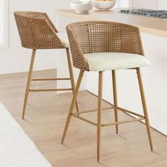 two wicker bar stools in a kitchen