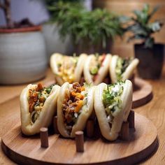 there are many small food items on the wooden trays that are ready to be eaten