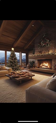 a living room filled with furniture and a christmas tree in front of a fire place