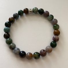 Brand New And Hand Made Stretch Bracelet With Real Indian Agate Stones. Approximately 8.0 Inches With 8.0 Stones. Gorgeous On And Great For Stacking! Comes In Gift Packaging Too! Bundle And Save- Just Message Me Earthy Green Agate Bracelets, Green Agate Hand-strung Crystal Bracelet, Hand-strung Green Agate Beaded Bracelets, Brown Agate Hand-strung Bracelets, Meditation Hand-strung Agate Crystal Bracelet, Indian Agate, Hand Crafted Jewelry, Crafted Jewelry, Agate Gemstone