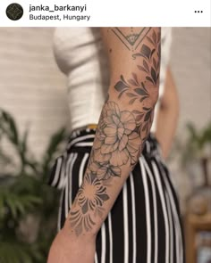 a woman with a flower tattoo on her arm and hand is shown in this instagramtion