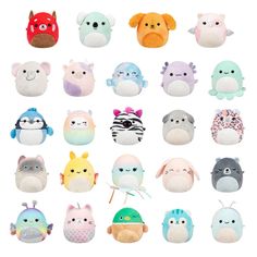 an assortment of small stuffed animals on a white background