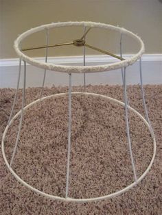 a white table sitting on top of a carpet covered floor