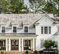 a large white house with lots of windows