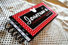 a red and white polka dot notebook with the name jenny's diary written on it