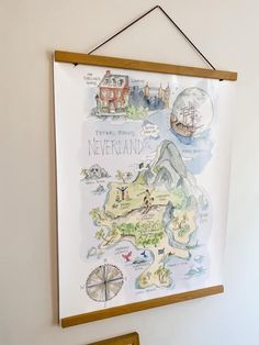 a map hanging on the wall next to a chair