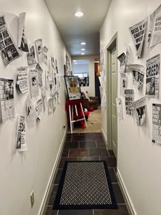 the hallway is decorated with newspaper clippings