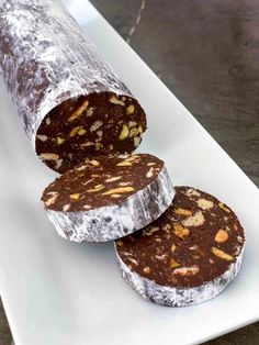 three pieces of chocolate cake on a white plate