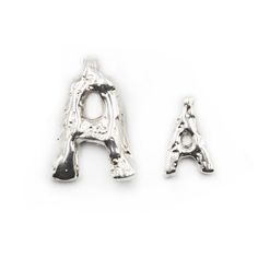 Our jewelry initials are crafted to let you express your unique identity. Each initial is designed with texture and movement, symbolizing the individuality of its wearer. Just like each one of us, these initials bear their own unique "scars," adding character and telling a story of resilience and beauty. Our products are handcrafted with love from .925 sterling silver, ensuring both quality and beauty. Proudly made in Guadalajara, Mexico, each piece reflects our commitment to excellence and eleg Luxury Sterling Silver Initial Necklace With Monogram, Luxury Sterling Silver Monogram Initial Necklace, Modern Tan Jewelry With Initials, Modern Initial Pendant Jewelry With Initials, Luxury Personalized Silver Initial Necklace, Silver Luxury Initial Necklace With Monogram, Modern Sterling Silver Jewelry With Initials, Jewelry Initials, Telling A Story