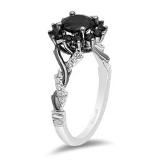 a white gold ring with black and white diamonds