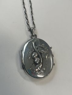 Georg Jensen sterling silver acorn locket, no 71, on rectangular link chain with small toggle clasp. The locket measures 1 1/2 inches tall ( almost 2 inches with the bail) and 1 1/8 inches wide. The chain is 20 inches long. The locket is hallmarked: Georg Jensen sterling Denmark 71 ( see photo) Vintage Hallmarked White Gold Locket Necklace, Antique White Gold Necklace With Locket, Antique White Gold Necklaces With Locket, Vintage Sterling Silver Oval Locket Necklace, Vintage Oval Sterling Silver Locket Necklace, Antique Silver Jewelry With Large Pendant, Classic Engraved White Gold Locket Necklace, Formal Sterling Silver Locket Necklace With Polished Finish, Silver Locket Necklace For Formal Occasions