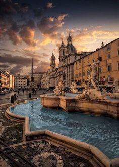 a fountain in the middle of a city square