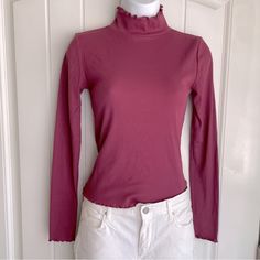 Petal Mauve Forever 21 Lettuce Edge Ribbed Long Sleeve Mock Neck Top Small Nwot. This Gorgeous Cotton-Blend Top Is A Classic Yet Spicy Piece To Pair With Boots And Jeans Or A Skirt. It Is New Without Tags, And In Immaculate Condition. Measurements Are 16” Pit-To-Pit, And 20” In Length. The Top Does Have A Little Bit Of Stretch To It. (Fits A Little On The Shorter Side; Most Regular Tops Are About 23”.) Comes From A Smoke-Free, Doggo Loving Home :) Purple Tops For Fall Layering, Purple Ribbed Stretch Top, Purple Stretch Ribbed Tops, Stretch Purple Ribbed Tops, Stretch Ribbed Purple Tops, Winter Purple Fitted Tops, Fitted Purple Winter Tops, Fitted Purple Tops For Winter, Purple Fitted Top For Fall