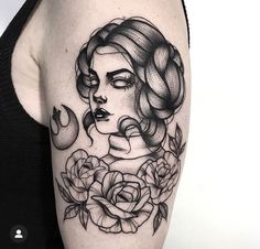 a woman's face with roses and snake tattoo on her arm, in black and white