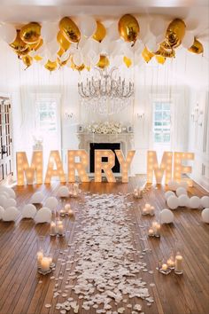 a room filled with lots of balloons and confetti on top of the floor