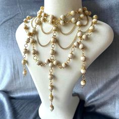 I designed this necklace, inspired by the elegant style of the Victorian era. Combining delicate white beads with antique-colored bead caps, I created a layered, draped effect that brings a touch of vintage luxury to life. This design blends the splendor of the past with modern sophistication, making it more suitable for elegant occasions rather than everyday wear. It's a  choice for those who wish to feel like royalty, carrying elegance and grace around their neck. The intricate details merge the refinement of history with a contemporary twist, allowing you to make a regal impression with every step you take. Choker Necklace Max Length: 17.5 inches (44 cm) P.s. : If you want to be informed about new models, don't forget to follow my store!  You can send a message for all your questions 🥰 Edwardian Necklace, Victorian Necklace, The Victorian Era, Victorian Jewelry, Bead Caps, White Beads, Everyday Jewelry, Victorian Era, Last Minute Gifts