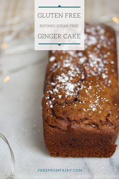 a loaf of gluten - free ginger cake on a plate with the title above it