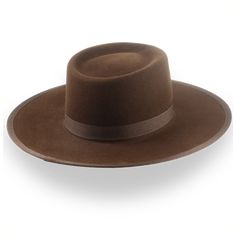 Description Materials Craftsmanship Hat Care Shipping Returns Product Description A Classic Brown Western Cowboy Hat Step into rugged elegance with the Vanguard, a brown western cowboy hat handcrafted from high-quality rabbit fur felt. Featuring a 4 1/2" telescope crown and a 3 5/8" ribbon-bound flat brim, this hat offers a perfect blend of classic western style and modern sophistication. The grosgrain ribbon hatband adds refined detail, while the custom fit ensures all-day comfort. Delivered in Homburg Hat, Brown Cowboy Hat, Outdoor Hut, Gambler Hat, The Raid, Mens Hats Fashion, Fedora Hat Men, Homburg, Chapeau Cowboy