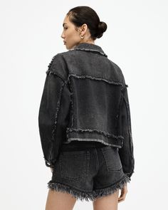 Distressed denim is our favorite. The Claude Jacket is frayed all along the seams. It's made from organic cotton and shaped to a classic denim jacket silhouette. The fit is relaxed and easy to wear, completed with a collar and two functional pockets. Looking for that signature AllSaints attitude? Here it is.   This jacket is designed to a relaxed fit Button closure Long sleeve Collar Heavily frayed along the yoke and seams Two chest pockets Edgy Cotton Denim Jacket With Relaxed Fit, Trendy Denim Jacket With Frayed Hem And Relaxed Fit, Ripped Cotton Outerwear With Relaxed Fit, Trendy Relaxed Fit Denim Jacket With Frayed Hem, Spring Washed Black Distressed Denim Jacket, Relaxed Fit Medium Wash Denim Jacket With Frayed Hem, Spring Distressed Washed Black Denim Jacket, Ripped Relaxed Fit Cotton Outerwear, Washed Black Relaxed Fit Denim Jacket For Spring