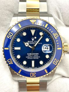 Rolex Submariner Date 41mm Blue Dial Two Tone Rolex Submariner Date 41mm Blue Dial Two Tone 126613LB Box + Papers 2021 This watch is a Rolex Submariner Date 41mm Blue Dial Two Tone Oyster Bracelet. The watch is in very good condition. The watch comes with the original box, green chronometer tag, manual, and warranty card. The warranty card is dated 2021. There are minimal marks on the bracelet and caseback, consistent with previous wear. The crystal and insert are free of damage. While we have not polished the watch, the watch has been previously polished. There are eleven (11) links on the bracelet. The watch fits an approximate 8.0" wrist size. Unfortunately, we will not include additional links in the shipment of the watch. However, if additional links are needed, they can be added to t Luxury Blue Chronometer Watch, Luxury Blue Watch Accessories With Subdials, Luxury Automatic Blue Watches, Luxury Blue Automatic Watches, Luxury Blue Watch Accessories For Formal Occasions, Luxury Blue Watch Accessories With Date Indicator, Elegant Blue Watch With Date Display, Elegant Blue Watches With Date Display, Blue Watch With Date Display As Gift