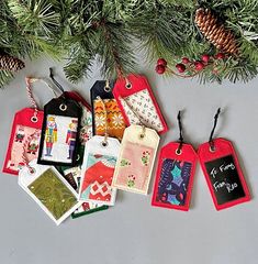 several tags hanging from a christmas tree