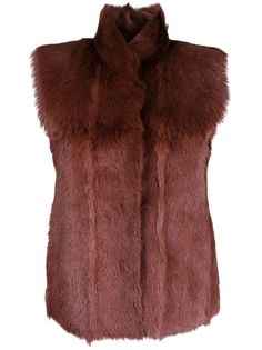 burgundy goat hair lambskin stand-up collar concealed front fastening sleeveless curved hem Sleeveless Mink Outerwear For Winter, Mink Sleeveless Winter Vest, Sleeveless Mink Outerwear With Faux Fur Lining, Sleeveless Fur Jacket, Luxury Brown Leather Jacket With Faux Fur Trim, Designer Brown Sheepskin Outerwear, Luxury Brown Mohair Outerwear, Luxury Mink-colored Winter Outerwear, Luxury Brown Faux Fur Outerwear