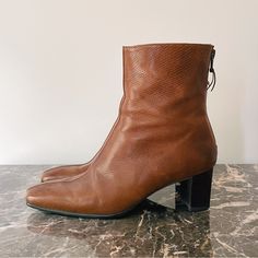 1990s-2000s Stuart Weitzman Brown Leather Square Toe Western Heel Booties Sz 6 - 6.5. These Boots Are Like A Modern Western Or Modern Cowboy Style With A Center Seam, Slightly Square Toe, Back Zipper, Block Heel. Size Is Listed 6 M. Year Is Estimated To Be 1990s-2000s But Not 100% Sure. Overall Great Condition; There Is A Nick On One Of The Toes, Some Darkening And A Couple Darker Spots On The Leather, Some Natural Leather Creating, And One Of The Heels Has A Small Repair (See Photo). Please Not Retro Heeled Boots For Formal Fall Occasions, Retro Heeled Boots For Fall Formal Events, Vintage Formal Boots Medium Width, Vintage Formal Boots With Stacked Heel, Modern Cowboy, Modern Western, Western Booties, Cowboy Style, Stuart Weitzman Shoes