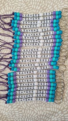 several rows of beads with numbers on them sitting on top of a white and blue blanket