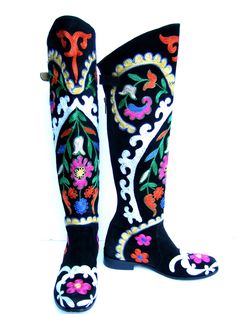 "Exotic embroidered boho style black suede floral boots Size 38 The dramatic suede embroidered floral boots are designed with elaborate floral designs in a myriad of vibrant eye-catching colors The stylish boots zipper up the backside with a buckle tab closure The interior of the boots are lined in soft tan leather Designed by Zeggani On Sale Reduced from $350 dollars Stamped Size 38 The tallest height from the top front of the boots opening to the base of the soles = 21\" inches Very Nice pre-o Boots Zipper, Floral Boots, Vibrant Eyes, Stylish Boots, Leather Design, Floral Designs, Boot Shoes Women, Tan Leather, Boho Style