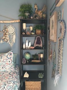 a bed room with a neatly made bed next to a book shelf filled with items