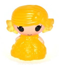 a yellow toy with black eyes and blonde hair