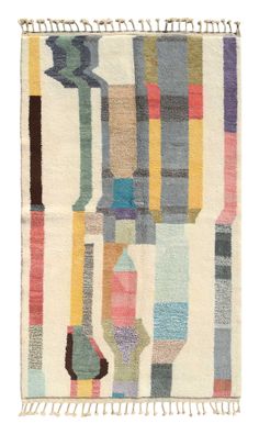 a multicolored rug with fringes on the bottom and an abstract design in the middle