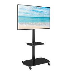 a flat screen tv sitting on top of a black stand