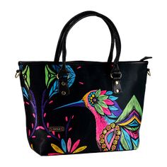 Our Tania bag is perfect for any time, inspired by fun and freedom with vibrant graphics. Dare to look unique with the Colibrí Art its design is enigmatic and original.• 100% synthetic fabric and vinyl• Inside pockets for cell phone and multifunction• Mangos with 6 " drop• Center compartment with zip• Synthetic makeup remover• Detachable strap with drop to shoulder or shoulder strap• Textile lining and metal fittings• Size: 16 "(L) x 11 1/2" (H) x 4 "(W)