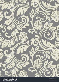 grey and white floral wallpaper with swirls on the sides, in an ornate pattern