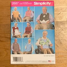 an old man sitting in a wheel chair on top of a wooden floor next to a book